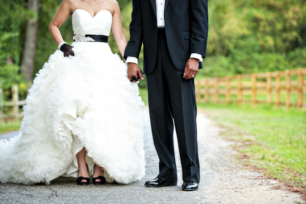 detail shot of white and black bridal dress and shoes and groom's tuxedo - wedding photo by top Atlanta based wedding photographers Scobey Photography